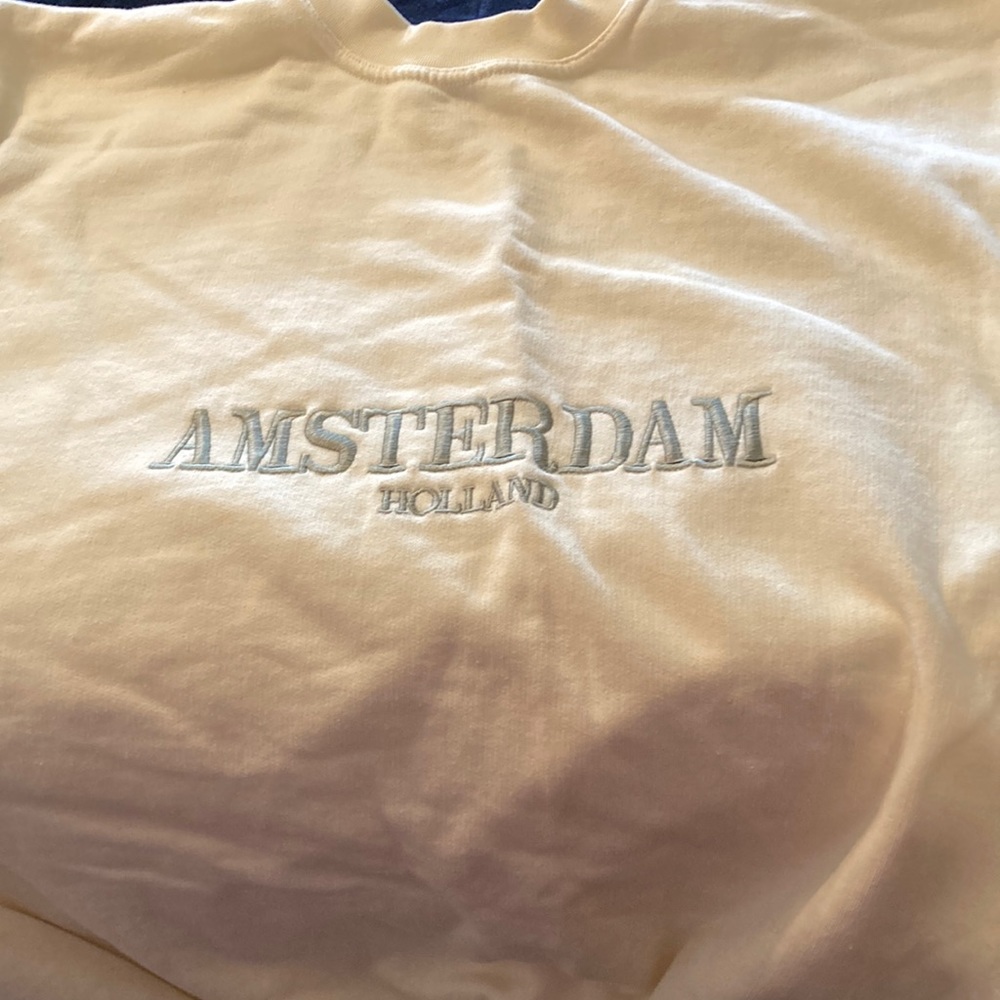 XL Amsterdam sweatshirt is n beige with grey lettering